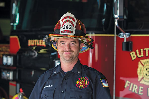 Chief of Borough of Butler Standing in Front of Their New Enforcer Ascendant 120' Heavy-Duty Aerial Platform - Single Rear Axle