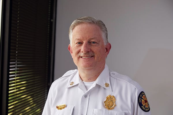 Knoxville Tennessee Fire Department Chief in Front of his Pierce Velocity Pumper Fire Truck Chassis