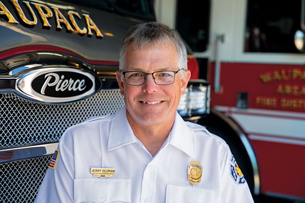 Chief of Waupaca Area Fie District in Front of Their New Impel PUC Pumper Fire Truck