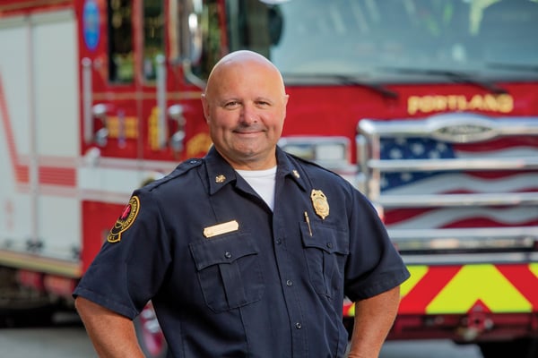 Chief of City of Portland Fire Department in Front of Their New Enforcer Combination Rescue Fire Truck