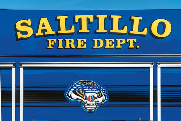 Saltillo Fire Department in Mississippis graphic on their blue fire truck with tiger head mascot.
