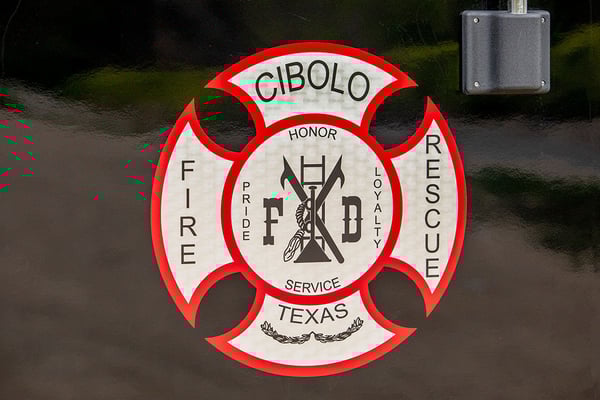 The Cibolo Fire Departments patch graphic on a fire truck door.