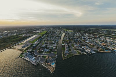 An aerial photograph shows communities along Great South Bay on Long Island, New York. 