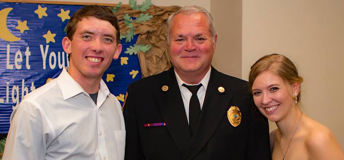 Spartan Fire and Emergency Apparatus sales representative, Alan Axson, attends wedding of baby he helped save in 1996.