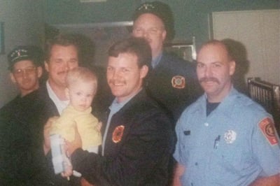 The rescue team from Columbia, South Carolina Fire Department visit 9-month-old Tara in the hospital.