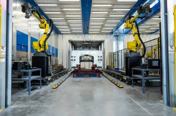 Advanced robotic buffing and sanding cell at a Pierce fire apparatus manufacturing facility.