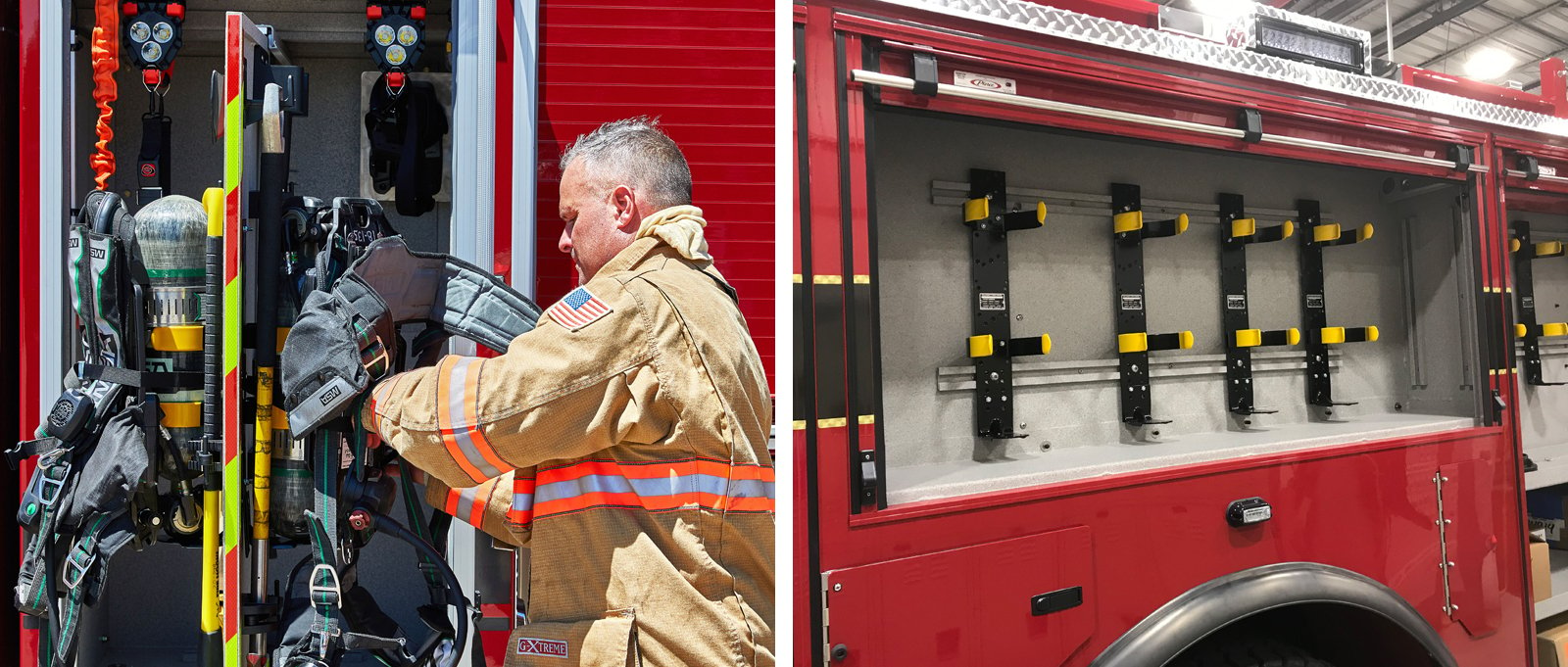 A firefighter accessing tools and gear from compartments located on the exterior of two red fire trucks. 
