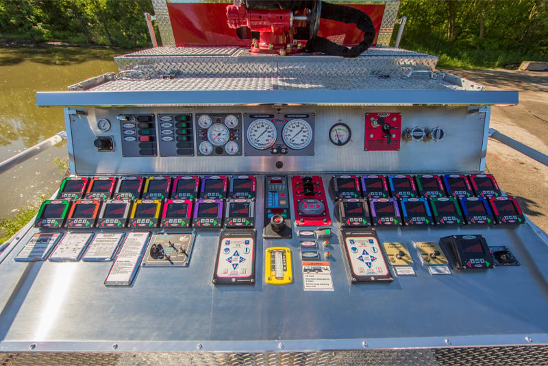 A close up view of the operator panel of an industrial fire truck. 