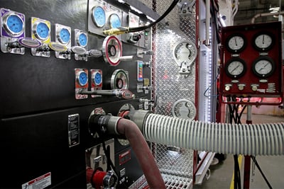 A fire truck water pump undergoes UL testing in a testing facility. 