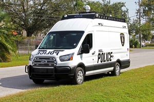 Front and side view of the Pierce Manufacturing CRU-22 Rescue Truck. This truck resembles a van more than a fire truck, but offers a full command communication and technology center inside.
