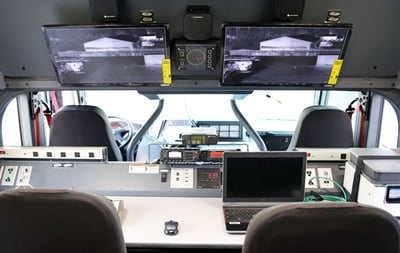 Interior view of the Command Rescue Apparatus showing four seats and monitors of camera footage.