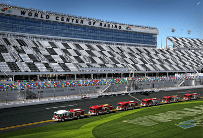 Pierce fire trucks lined up on the racetrack at the Daytona International Speedway