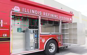 Side view of a Pierce Manufacturing Encore Rescue Truck. Showcasing how compartments are built transversely, or crosswise, instead of lengthwise.