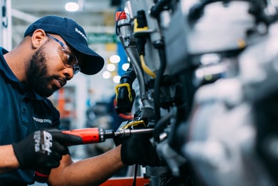 An assembler works on a PACCAR MX-13 fire truck engine, which offers easy maintenance, quality, durability and high performance. 