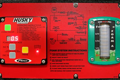 Pierce Husky 3 foam system circuit board with the foam system’s instructions, buttons with options for turning the system on and off, foam percentage and a gauge showing the fullness of the foam tank’s contents. 