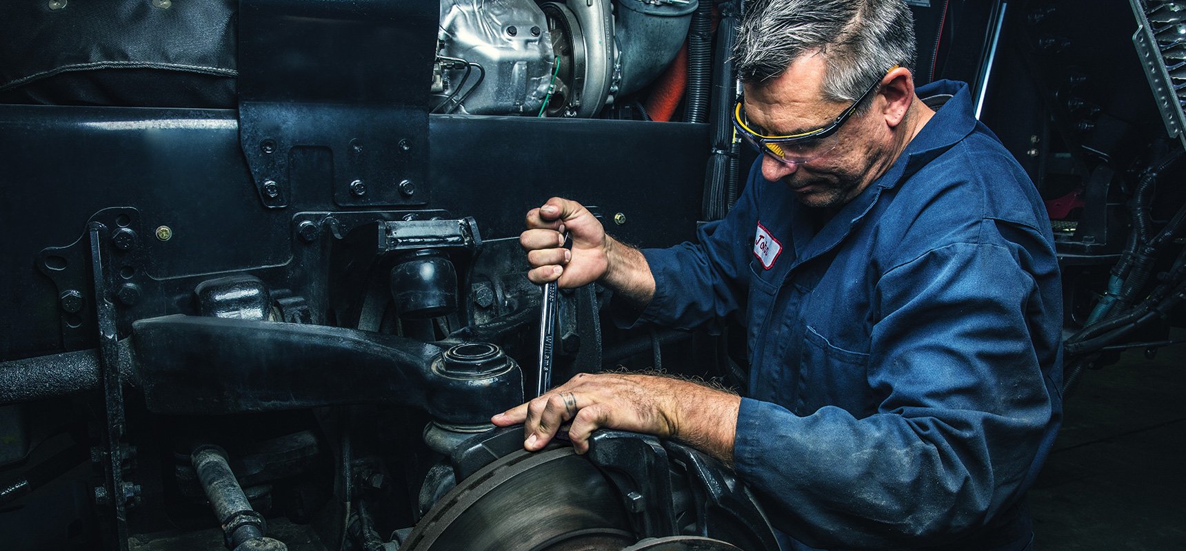 Pierce mechanic works on Pierce fire truck 