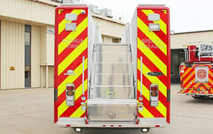 Rear view of a Pierce Manufacturing Walk-in Rescue Truck. Rear view showing steps that lead to the top of the apparatus.