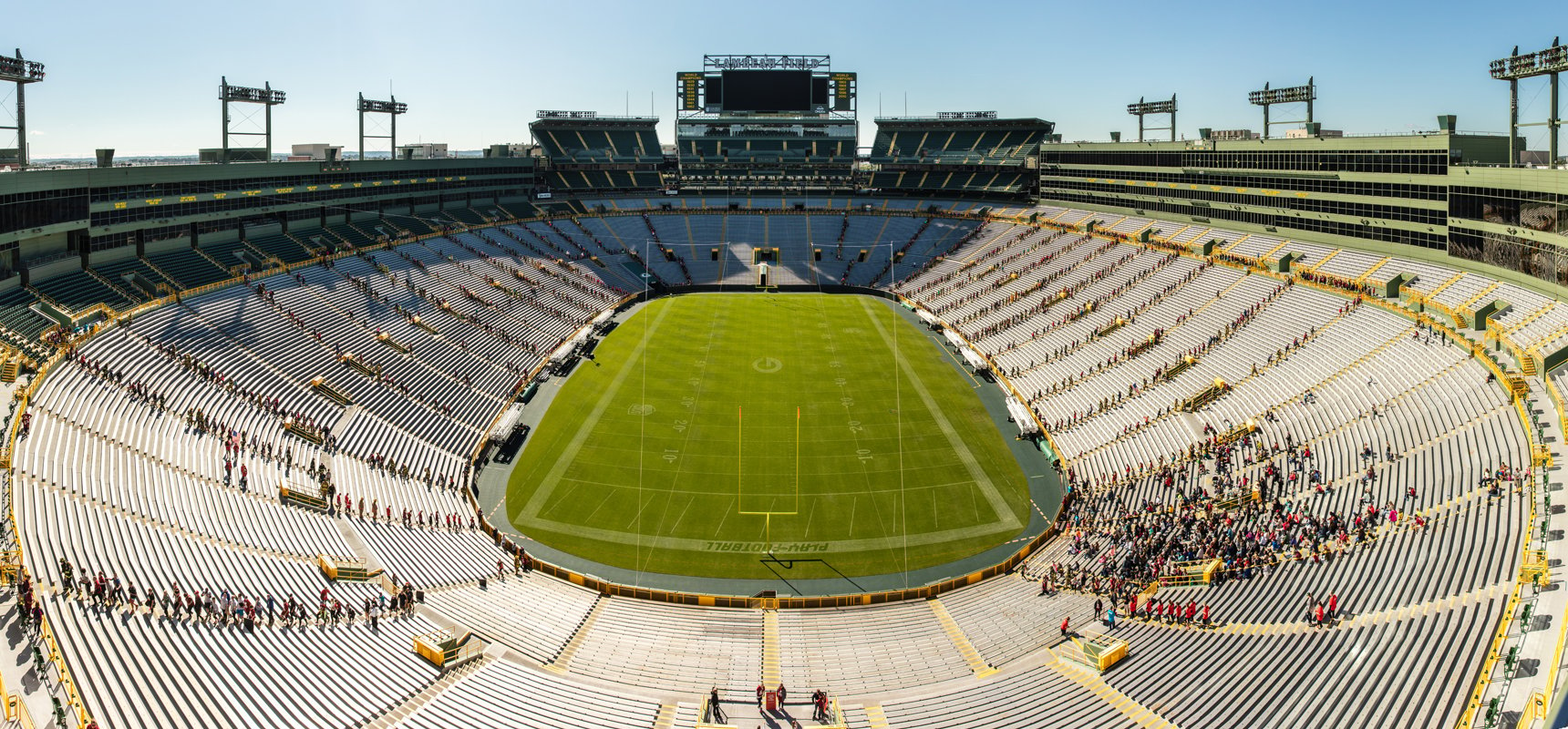 Wide, aerial view of the 9/11 memorial stair climb taking place at Lambeau Field in Green Bay, WI. People are climbing up and down the steps