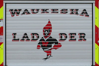 Rear view of a Pierce fire apparatus displaying Waukesha South High School mascot with graphics.  
