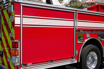 A red and white fire truck roll up door shows the door construction detail.