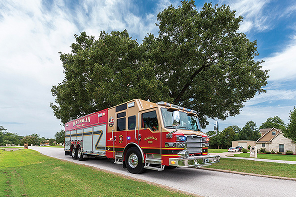 Non-Walk-In Rescue Fire Truck Officers Side Driving Down Road