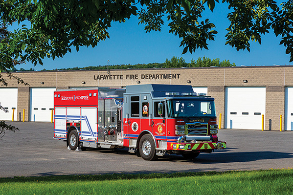 Heavy-Duty Rescue Pumper Fire Truck in Front of Fire Station
