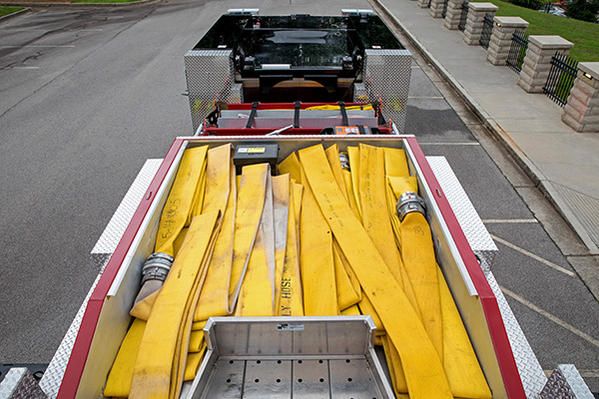 Hose loaded in top of aerial ladder fire truck