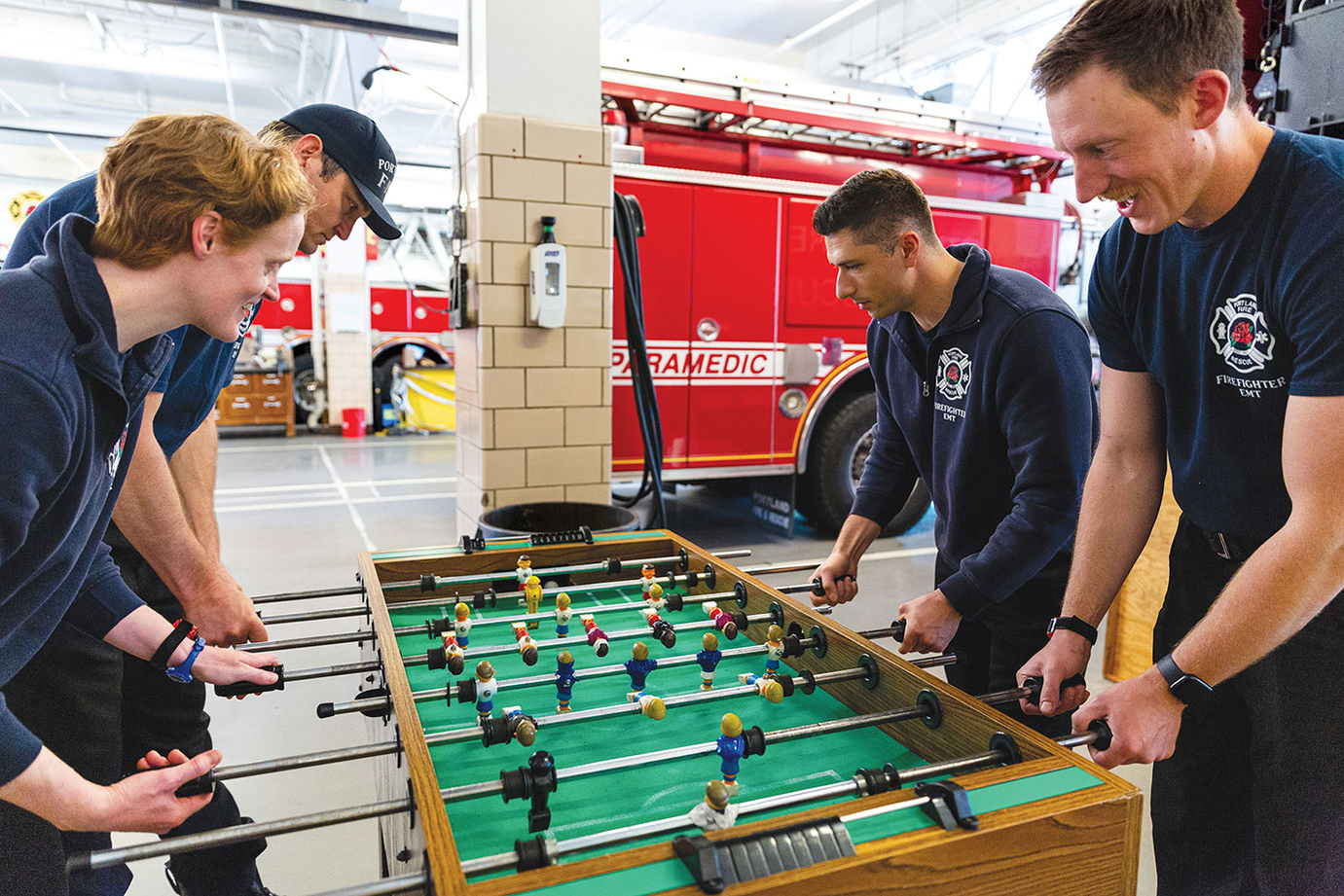 Four Portland Oregon Firefighters meeting in fire station