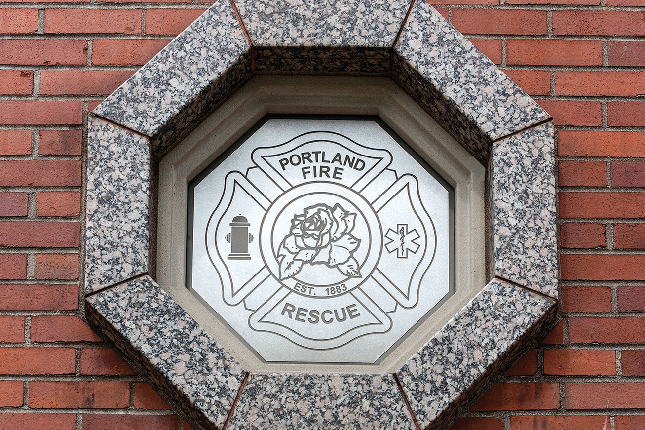 Portland Oregon Fire and Rescue Stone Emblem Logo on Brick Building