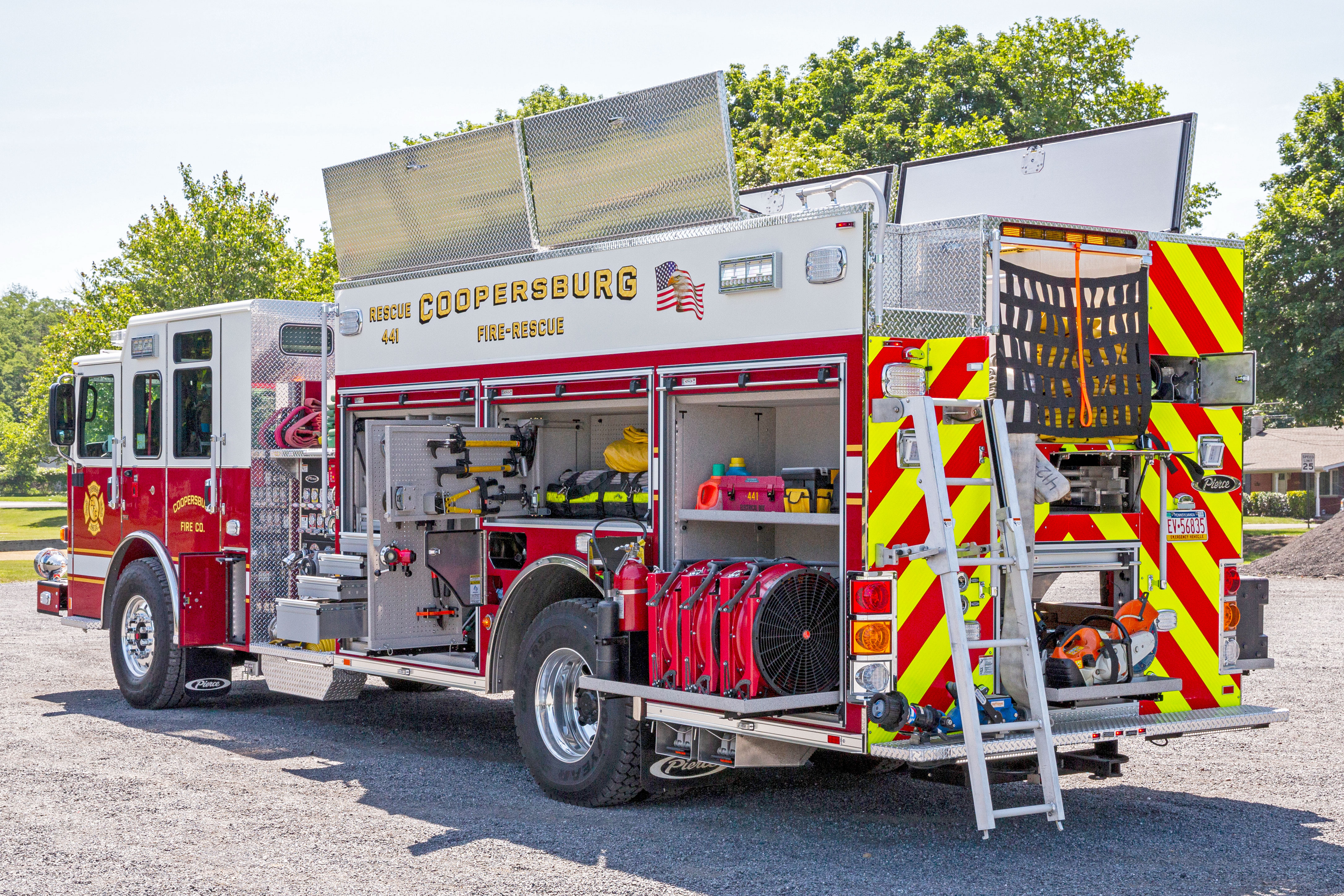 Drivers side and rear custom chassis heavy-duty rescue pumper compartmentation