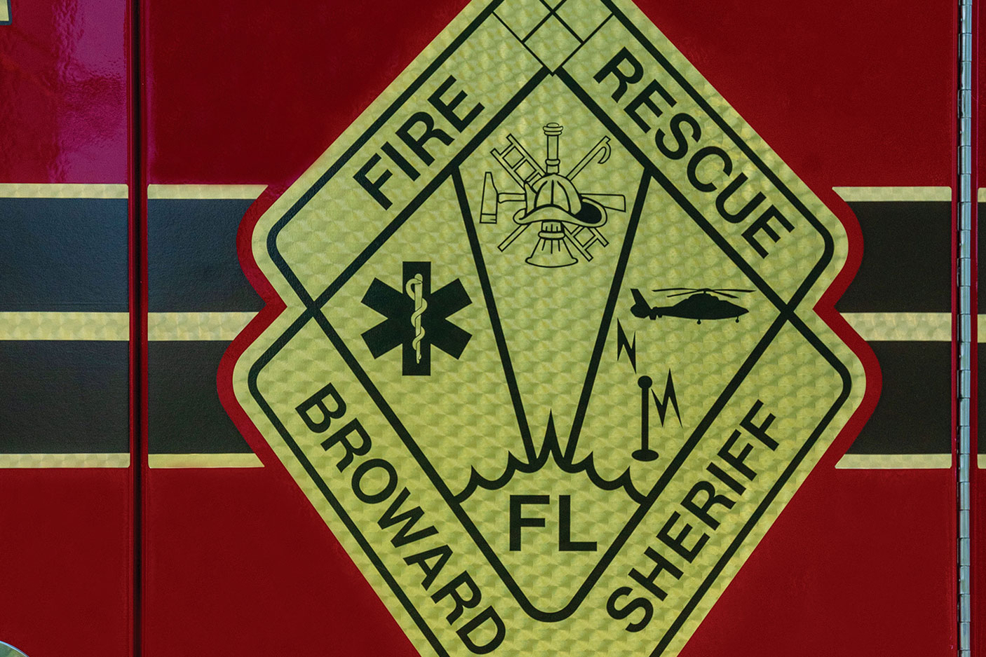 Custom gold leaf fire truck graphic on door panel for Broward Sheriff's Office in Florida