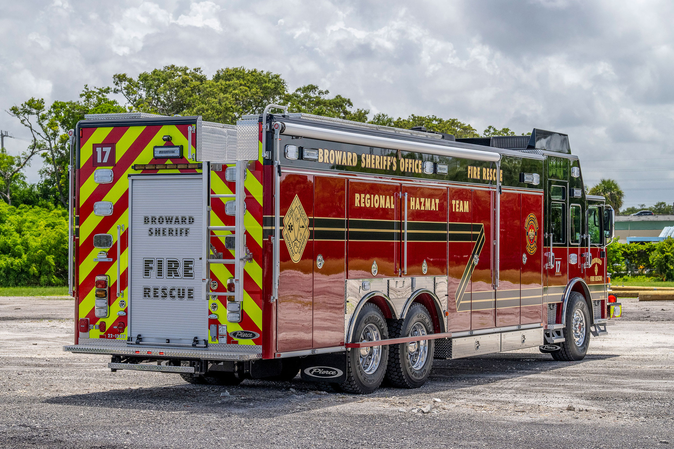 Passenger side and rear of combination rescue fire truck parked in Florida