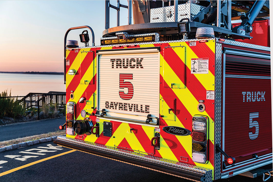 Rear of aerial fire truck Sayreville New Jersey graphic