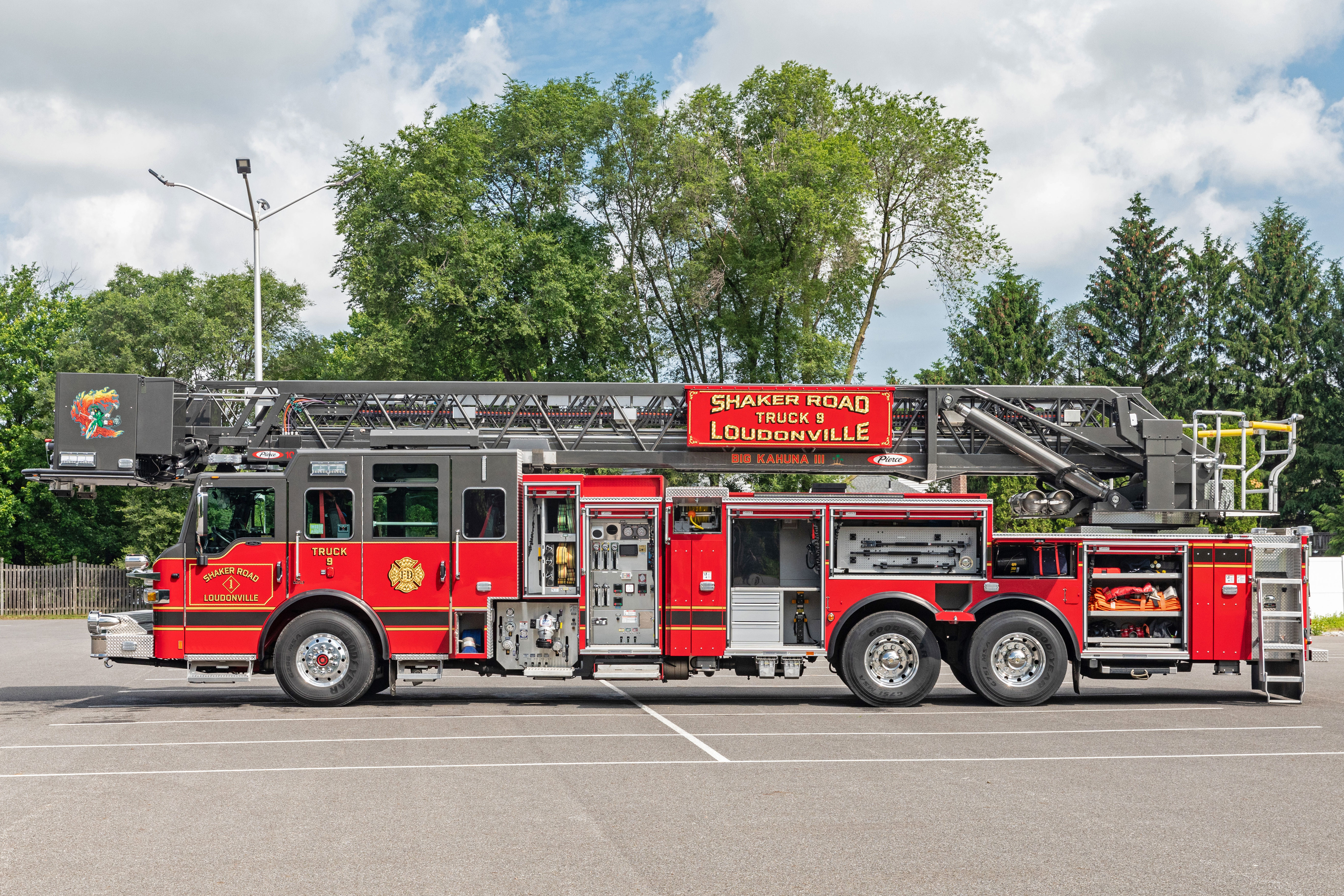 Aerial ladder fire truck drivers side compatmenation
