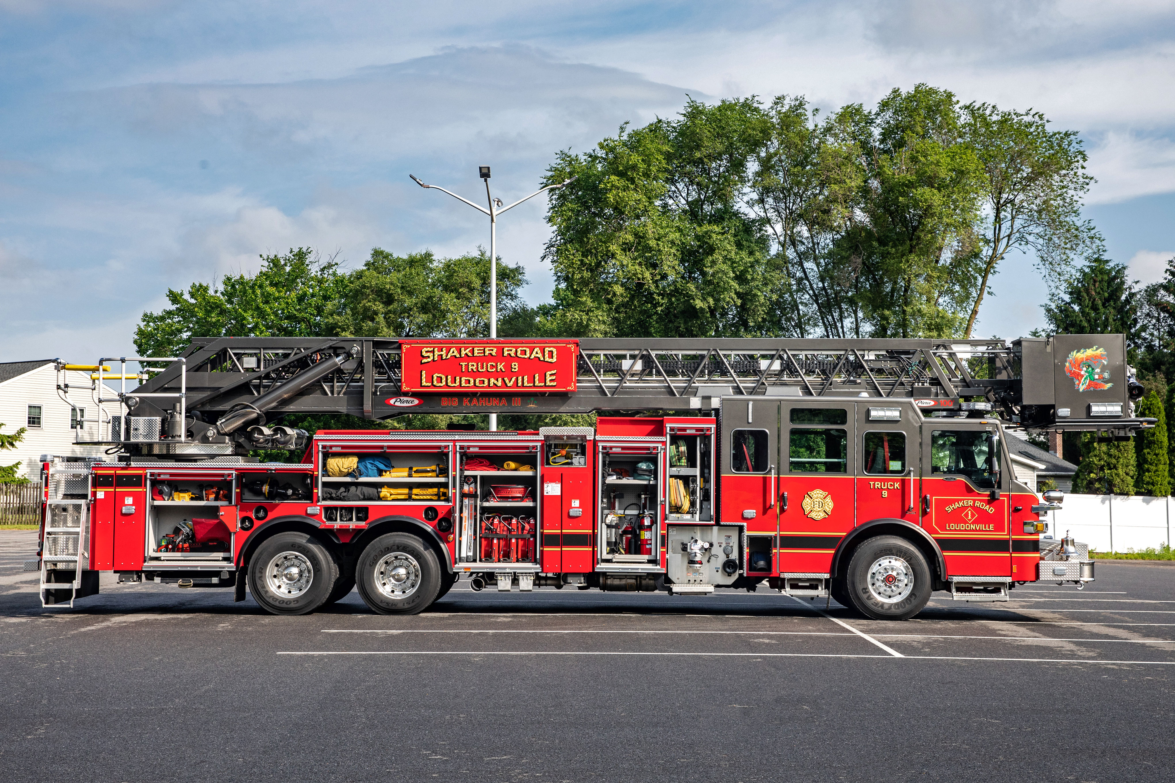 Aerial ladder fire truck officers side compatmenation