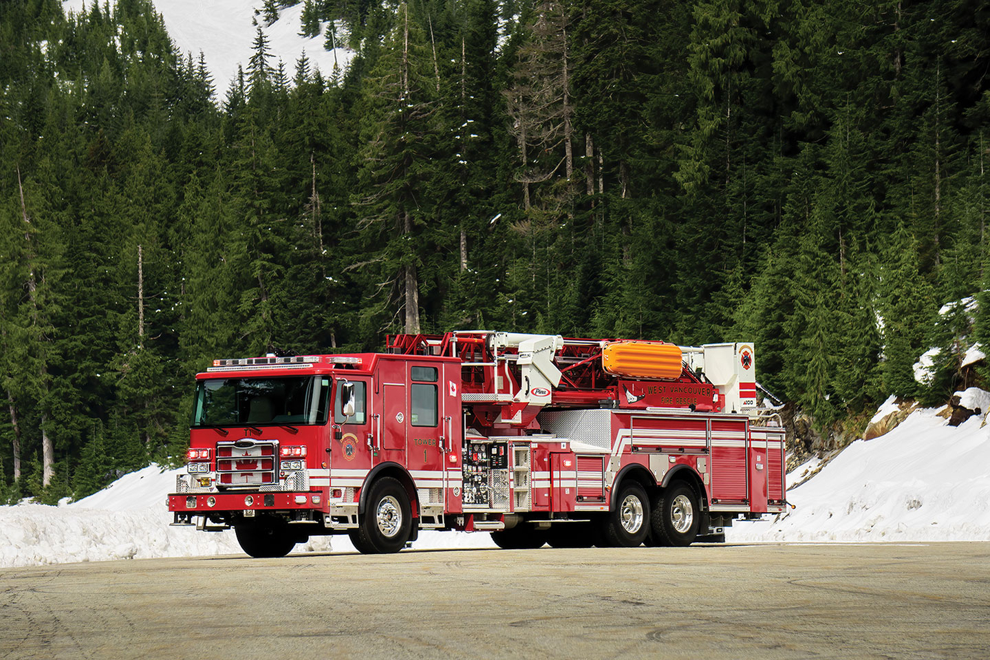 100 MidMount Aerial Platform parked in forest with snow in West Vancouver British Columbia