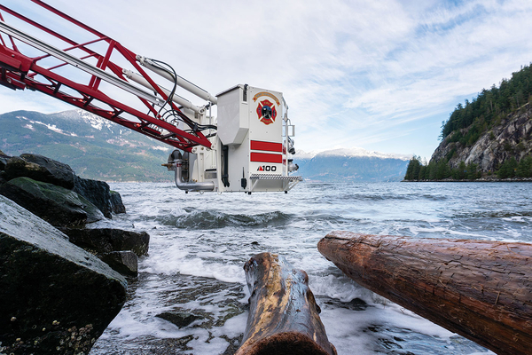 MidMount Aerial Platform Basket at a steep downgrade over flowing water