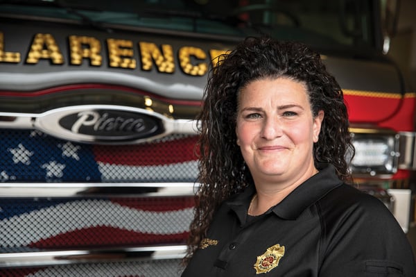 The fire chief for Clarence Fire District No.1 in New York posed in front of a fire truck.