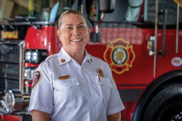 The fire chief of Ferndale Fire Department in Michigan posed in front of a fire truck.