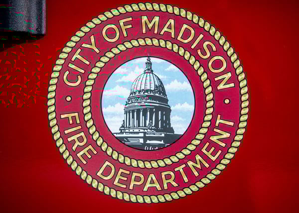 Logo 2 The Madison Fire Deparmtent logo graphic on a red EV fire truck door.-1