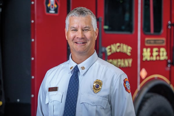 The fire chief of the City of Madison Fire Department in Wisconsin posed next to an electric fire truck.