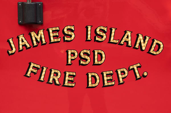 The gold leaf graphic on the door of a fire truck for James Island Public Safety District Fire Department in South Carolina.