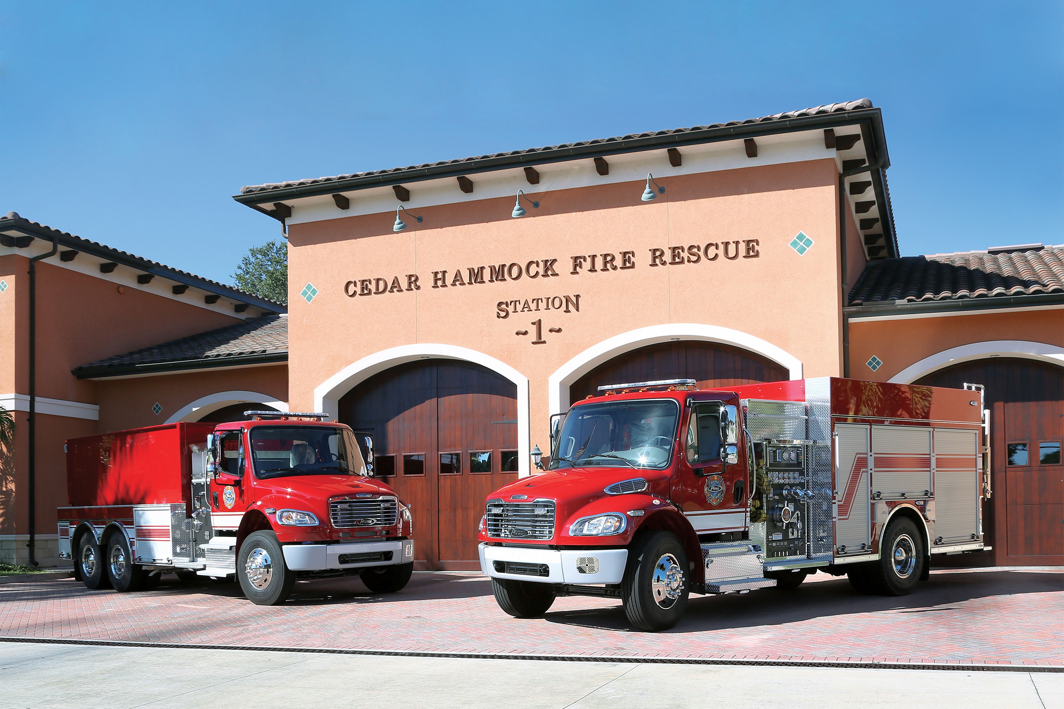 A Pierce Commercial Pumper and Tanker Chassis parked in front of Cedar Hammock Fire Rescue. 