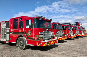 A lineup of red Pierce Enforcer fire trucks for Mississauga Fire and Emergency Services.