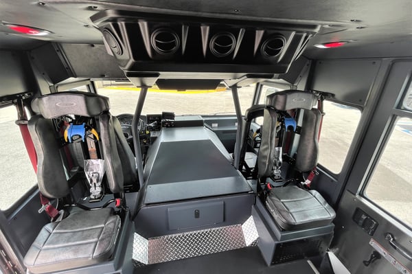 Black leather interior seating and cab of a Pierce Saber custom fire truck. 