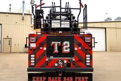 Rear view of the aerial platform with T2 markings and red safety chevrons.