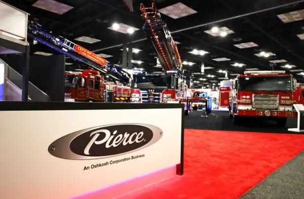Pierce fire trucks and aerial apparatus on display at the FDIC International 2026 trade show booth.