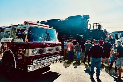 Villa Grove's Engine 101 fire truck near Union Pacific's Big Boy locomotive, during the historic water refill event.