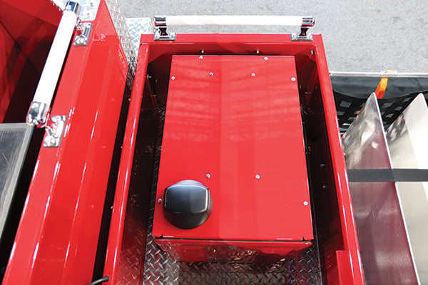 Idle Reduction Technology Aftermarket Solution Installed and Mounted in the cargo area of a Pierce red fire truck