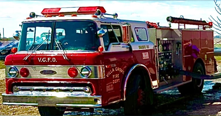 A red Pierce fire truck from 1986 that is still in service.